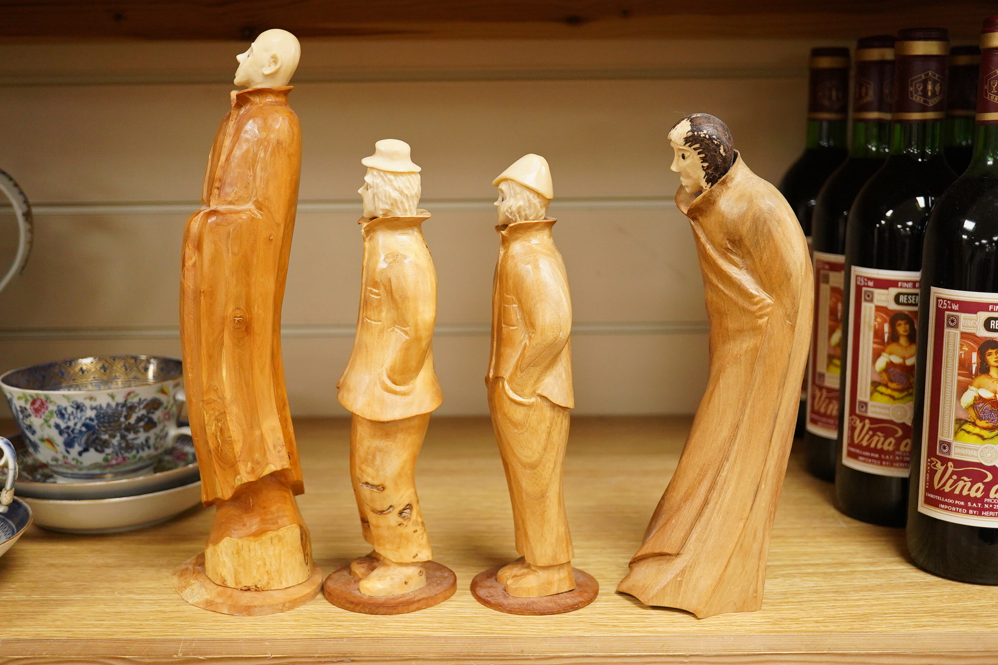 Pierre Decorse (b.1953), a group of four carved figures, tallest 29cm high